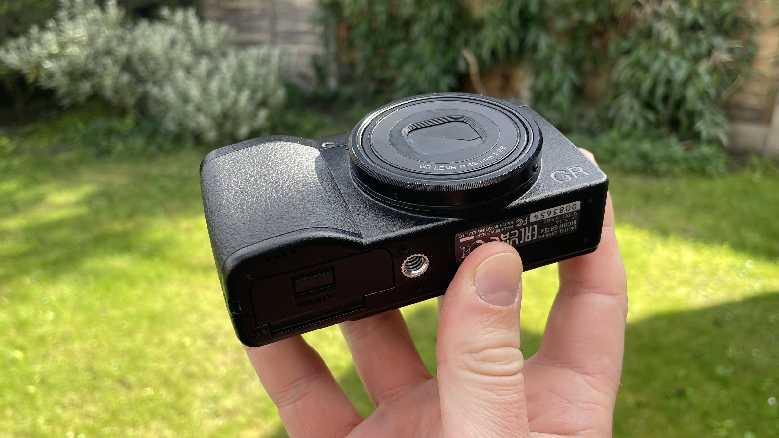 Ricoh GR IIIx HDF compact camera in hand