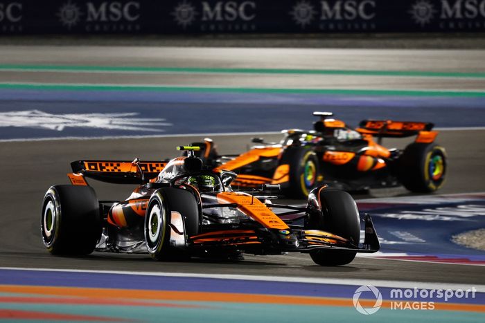 Lando Norris, McLaren MCL38, leads Oscar Piastri, McLaren MCL38