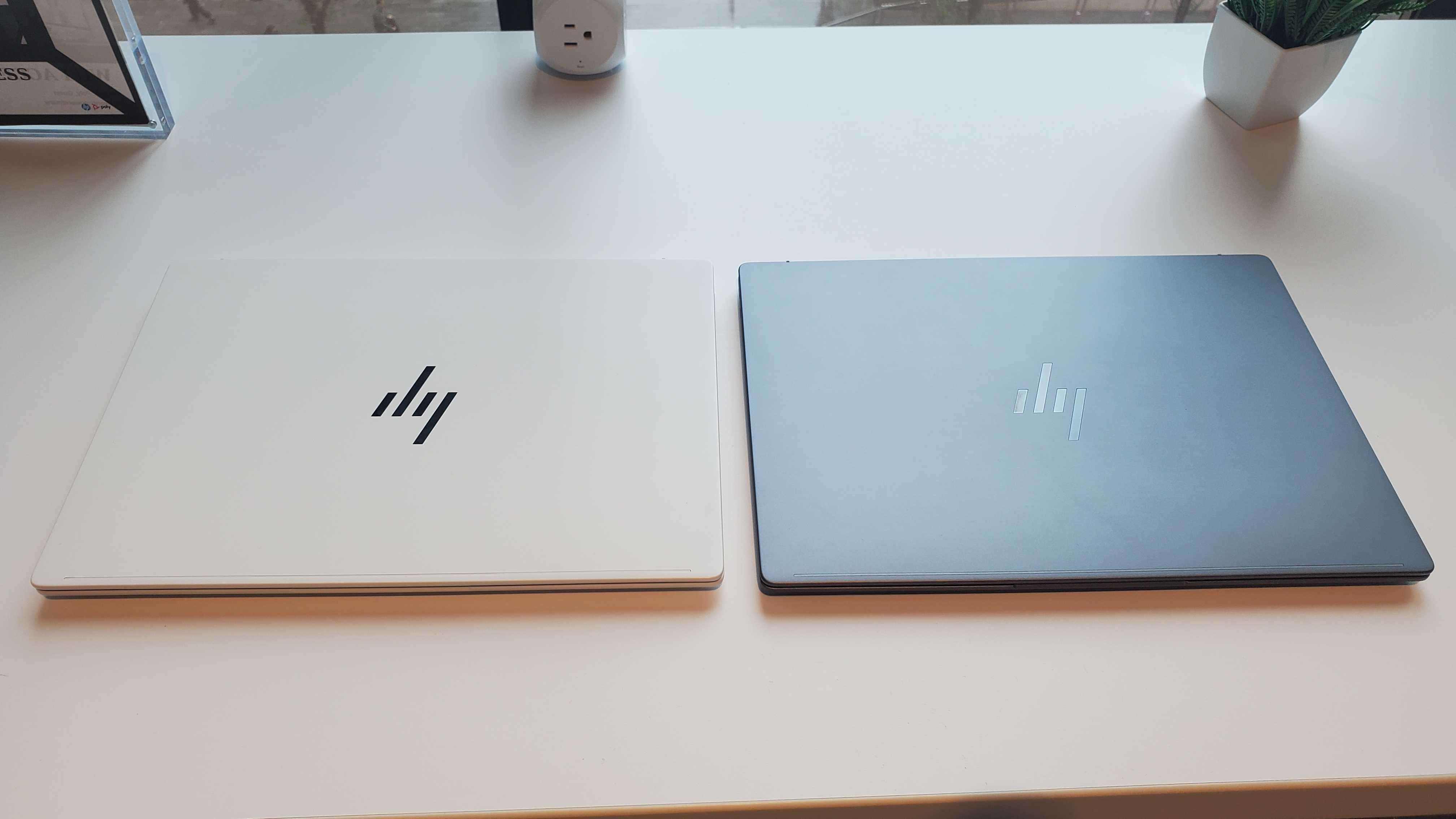 white and grey laptops on table