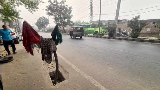 An uncovered road gully near Cheema Chowk in Ludhiana on Wednesday. (HT photo)