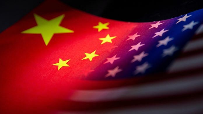 China's and U.S.' flags are seen printed on paper in this illustration taken January 27, 2022 | Reuters file photo