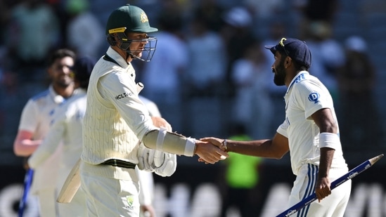 Australia's Josh Hazlewood shakes hands with India's Jasprit Bumrah after the Perth Test(AAP Image via REUTERS)