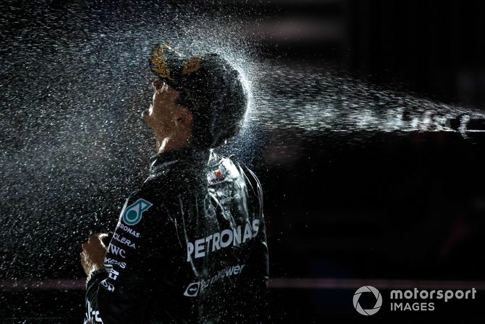 George Russell, Mercedes-AMG F1 Team, 1st position, is sprayed with Champagne on the podium