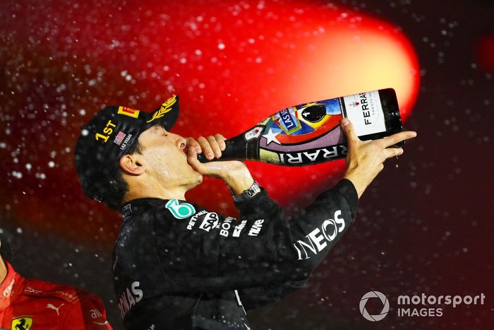 George Russell, Mercedes-AMG F1 Team, 1st position, drinks Champagne on the podium