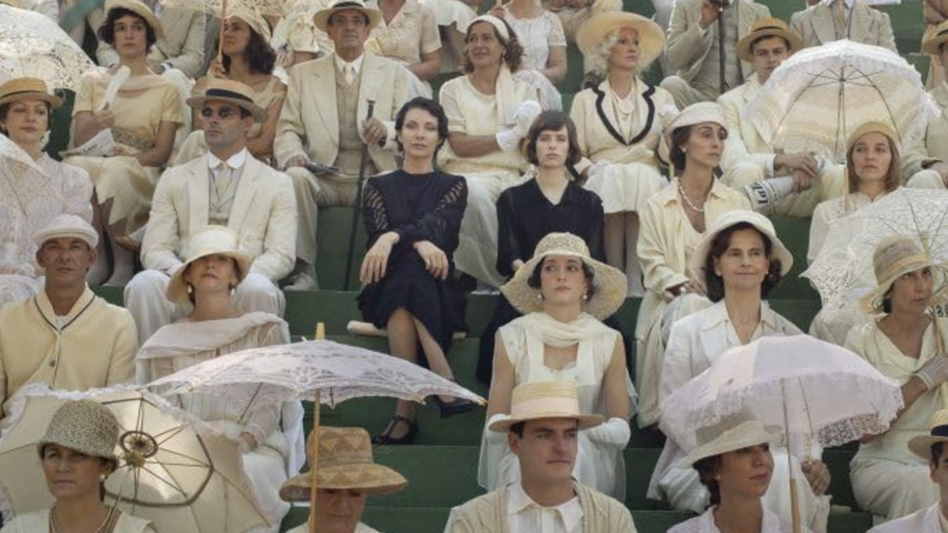 Hildegart sits with her mother, Aurora, wearing black in a crowd of white clothes