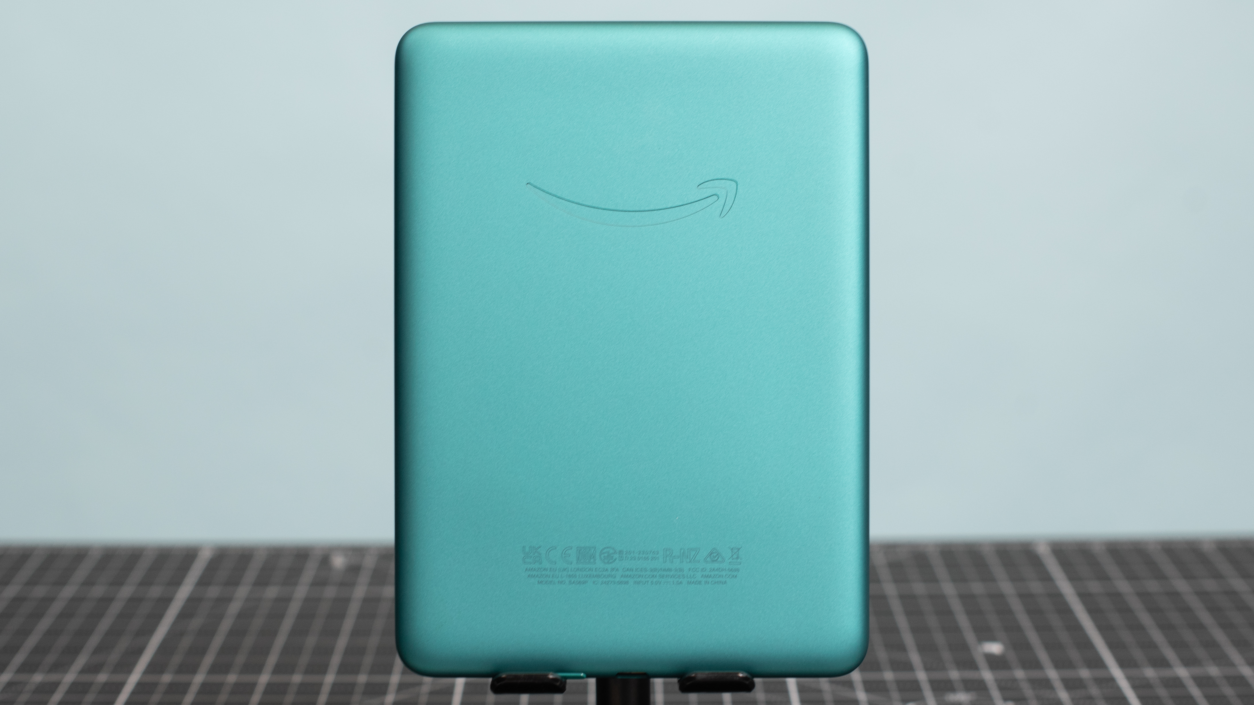 Kindle Paperwhite from the back showing Amazon smile logo