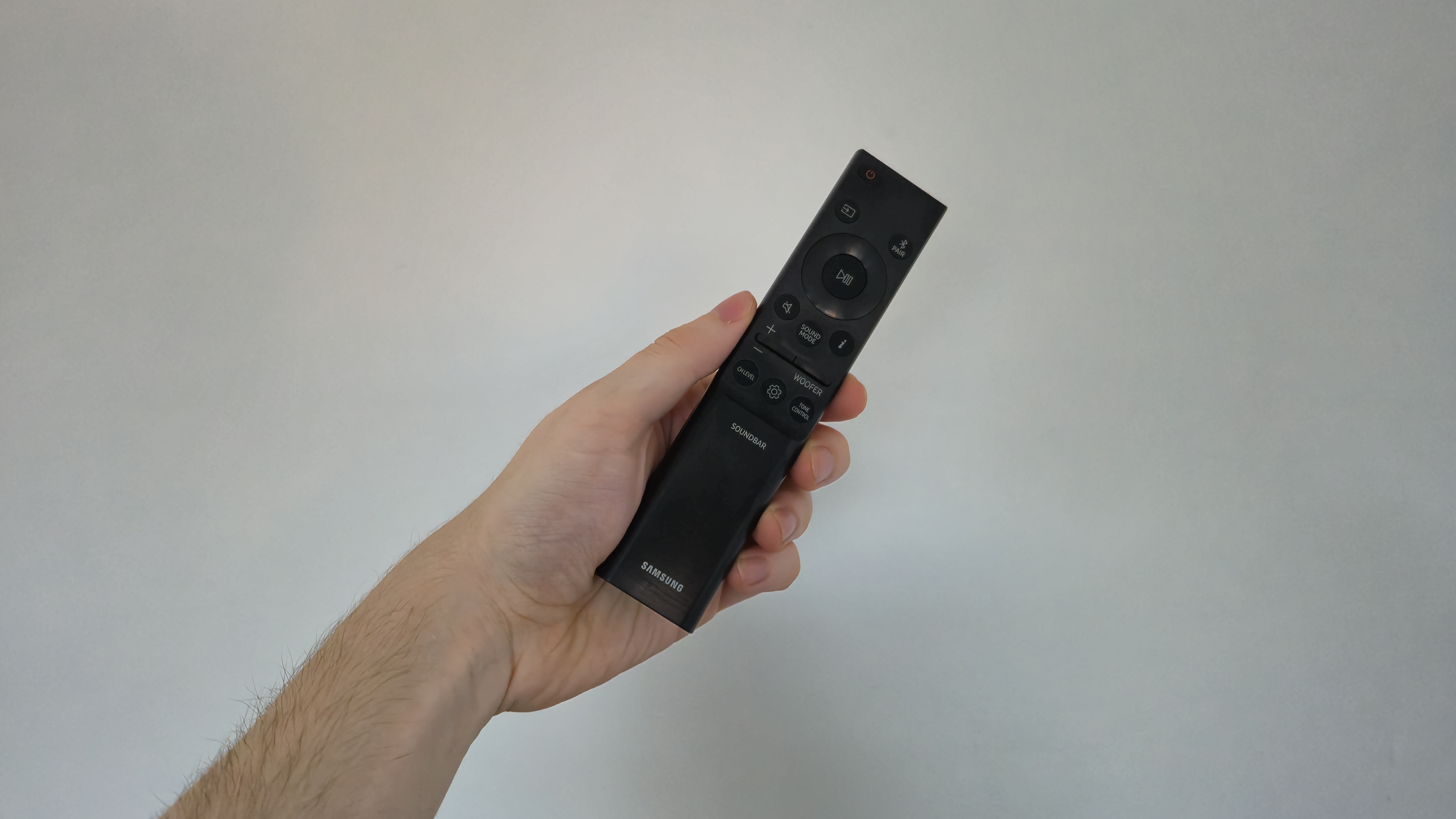 Person holding Samsung HW-Q800D remote