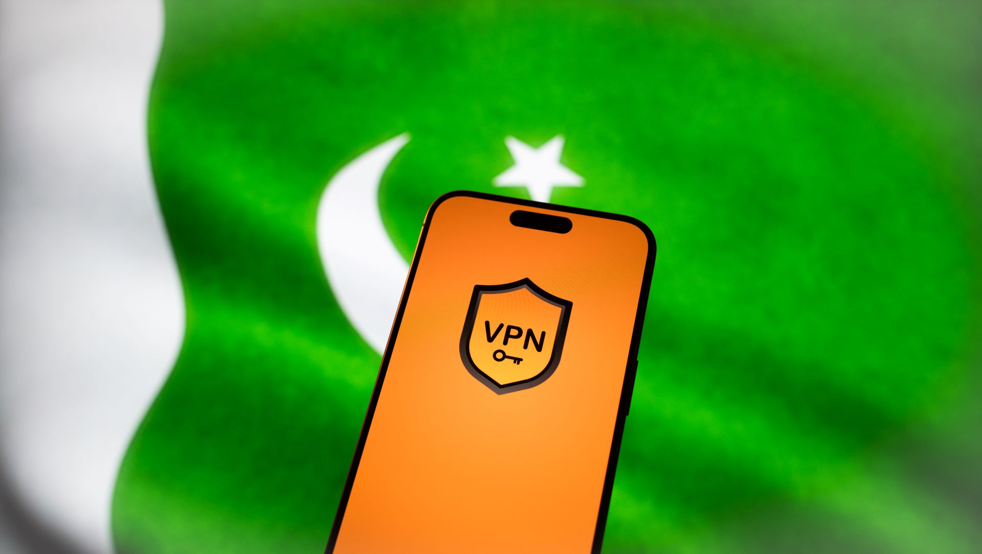 VPN logo on a smartphone on a Pakistan's flag background