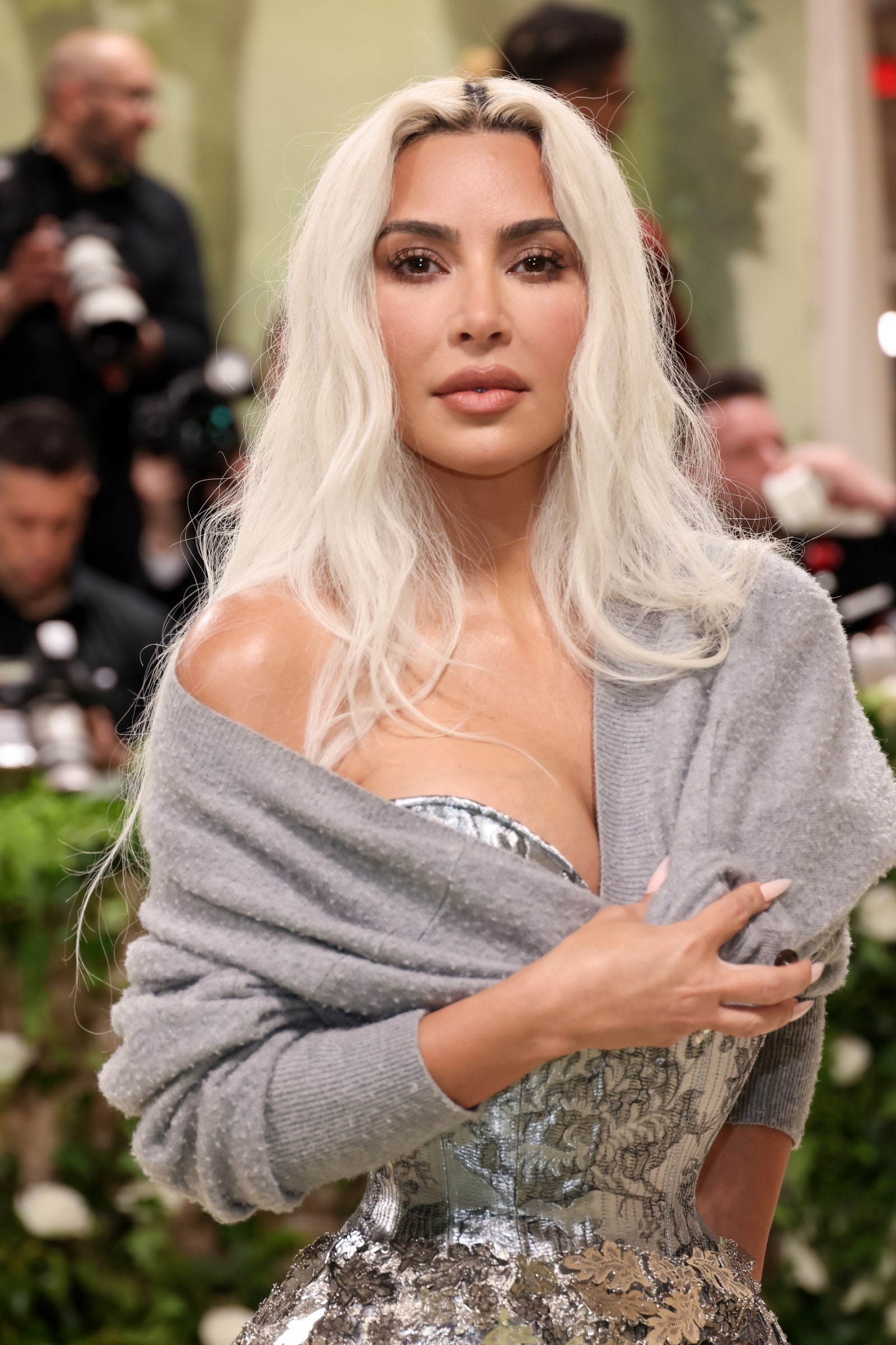 Image may contain Kim Kardashian Blonde Hair Person Adult Child Camera and Electronics