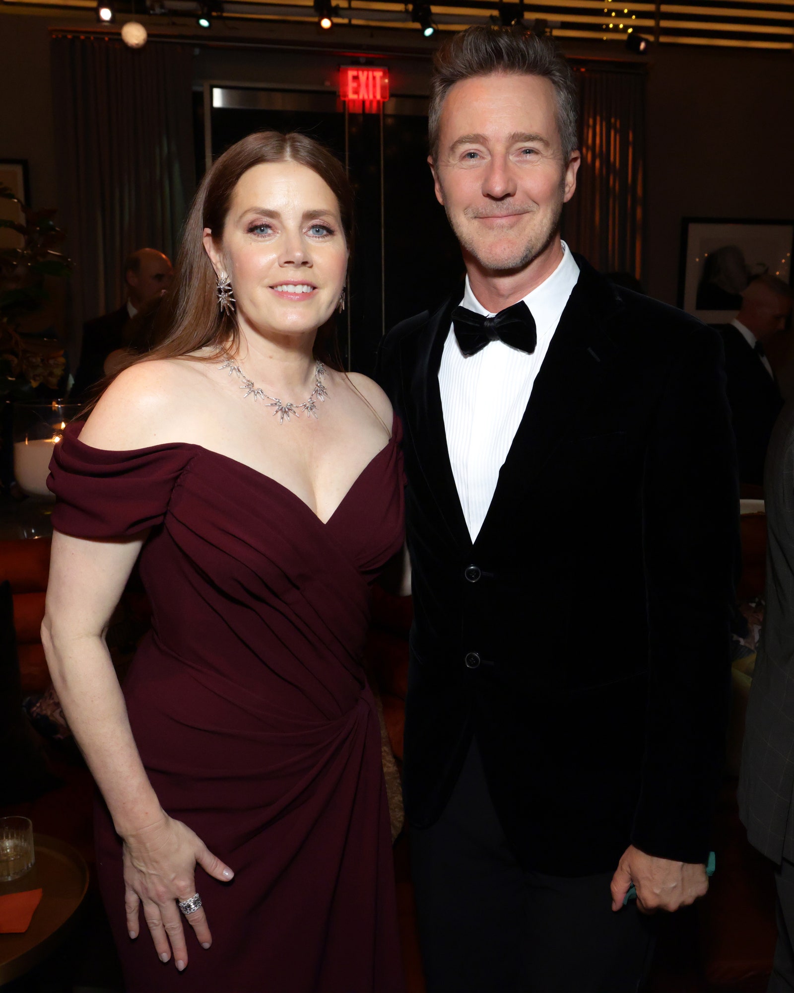 Image may contain Edward Norton Lucie Jones Clothing Formal Wear Suit Blazer Coat Jacket Accessories and Tie