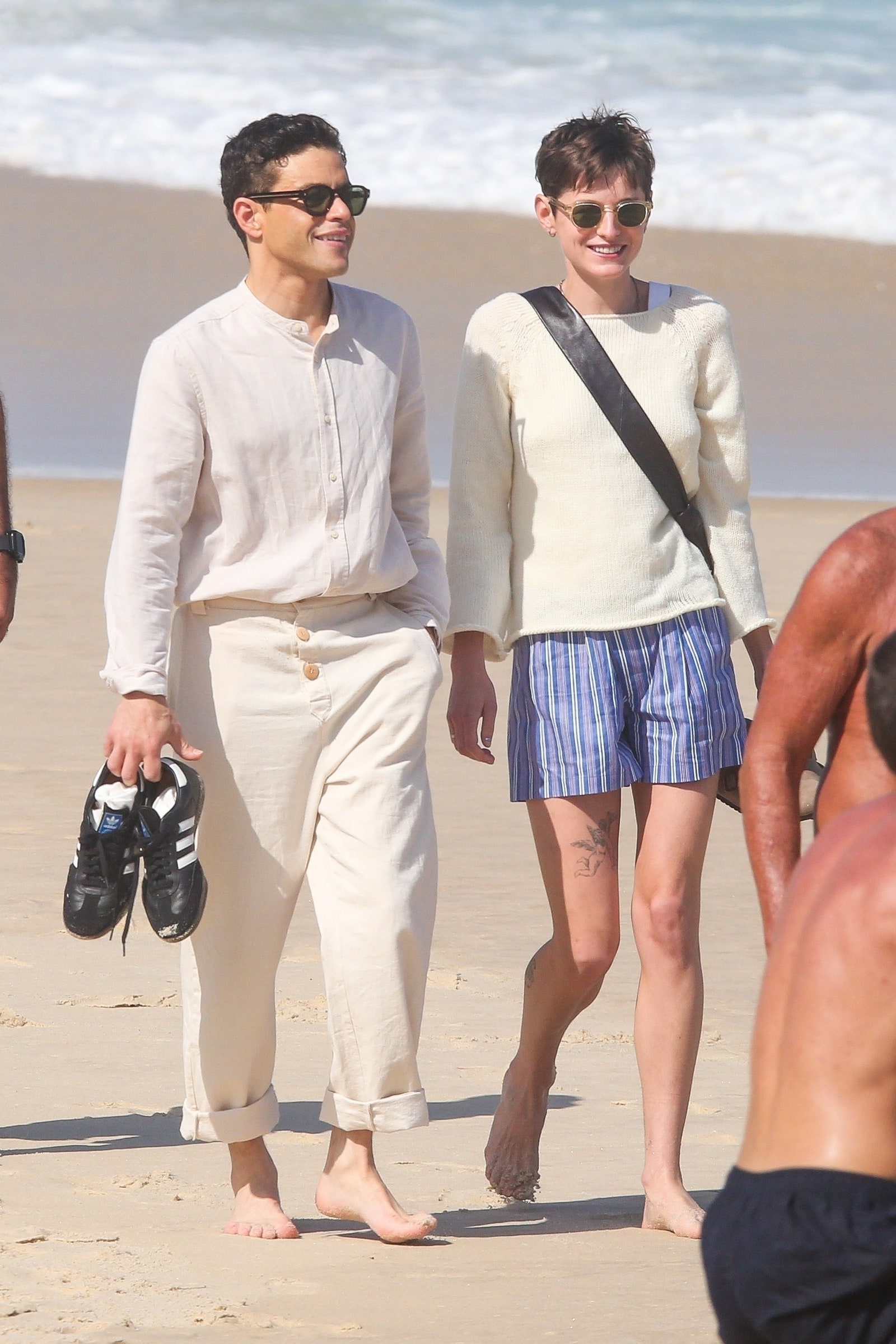 Rio de Janeiro BRAZIL  EXCLUSIVE  Rami Malek and Emma Corrin enjoy a stroll along the iconic Ipanema Beach taking in the...