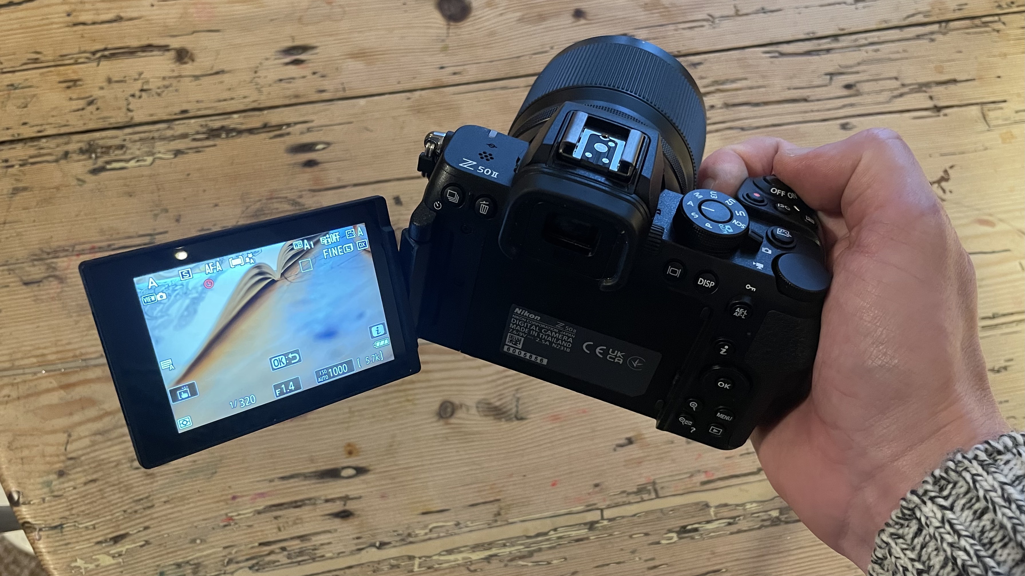 Nikon Z50 II mirrorless camera on a wooden tabletop