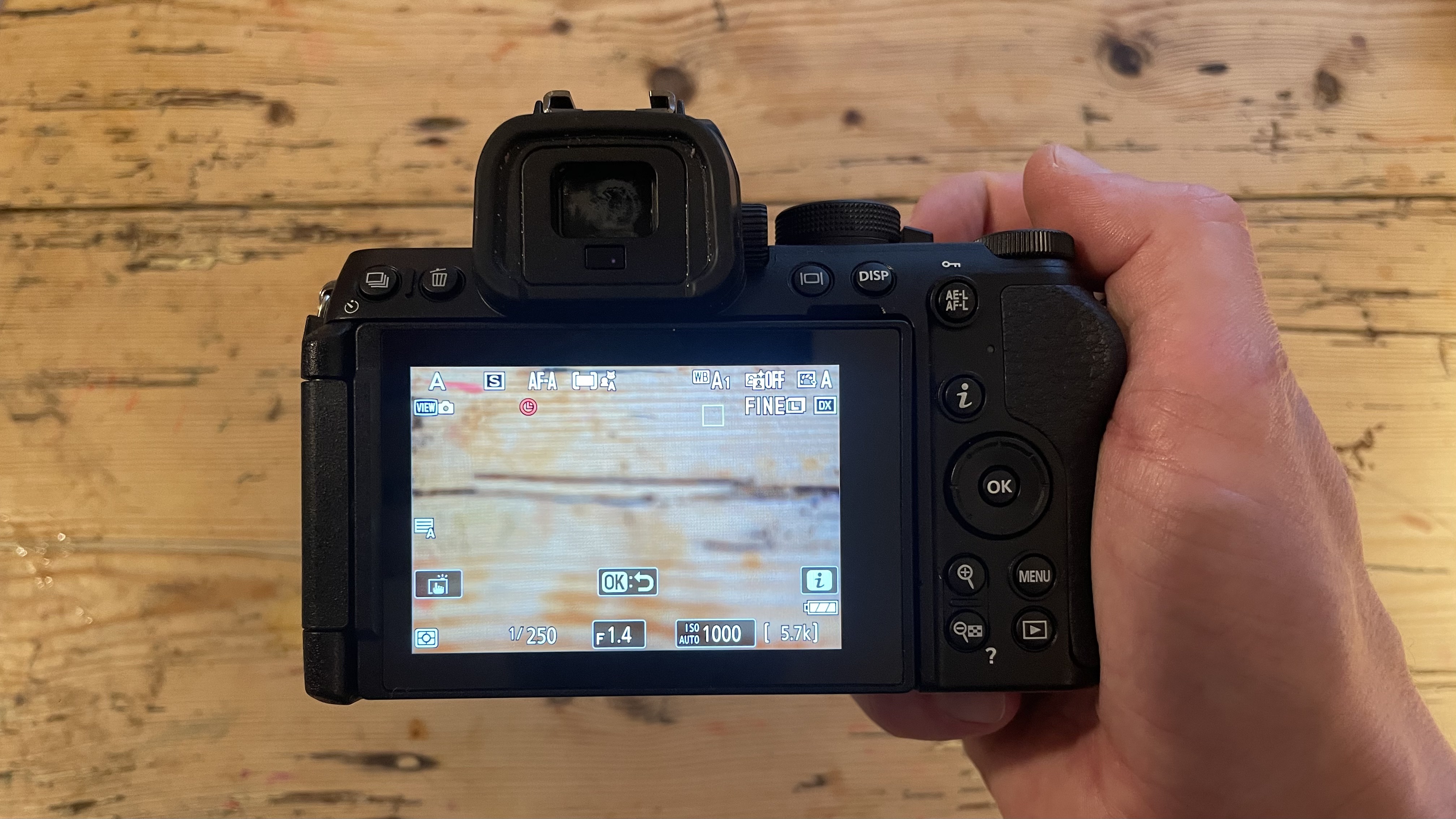 Nikon Z50 II mirrorless camera on a wooden tabletop