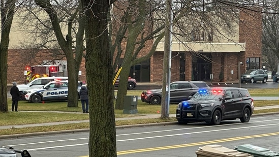 Emergency vehicles are parked outside the Abundant Life Christian School in Madison, Wis., where multiple injuries were reported following a shooting, Monday, Dec. 16, 2024. (AP Photo/Scott Bauer)(AP)