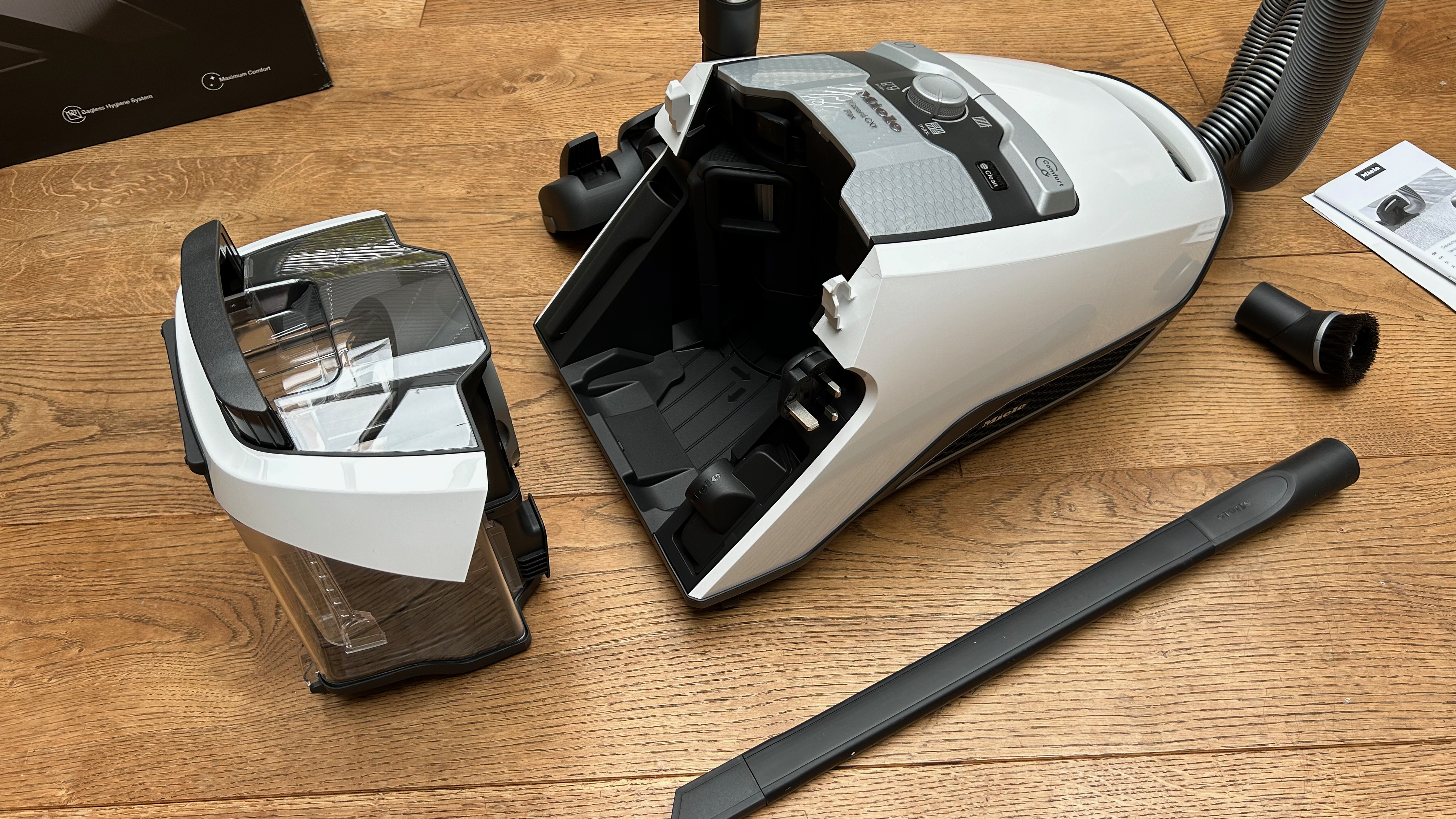 Miele Blizzard CX1 canister vacuum broken apart into its component pieces