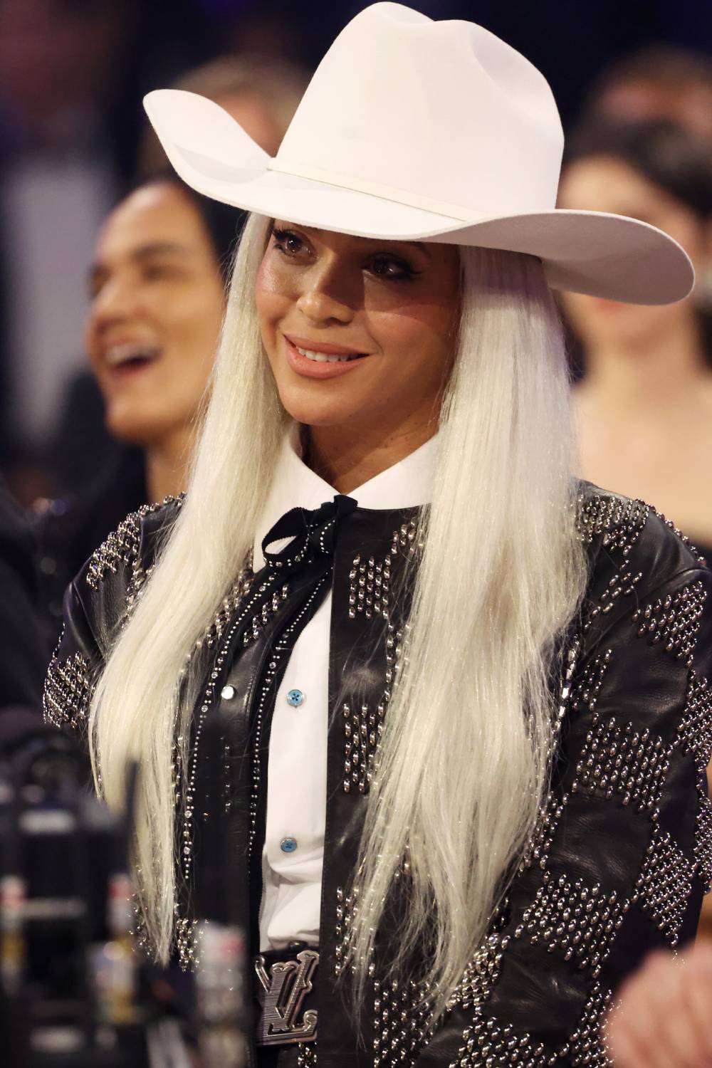 Beyoncé supports Jay-Z as he accepts the Dr. Dre Global Impact Award during the 66th GRAMMY Awards