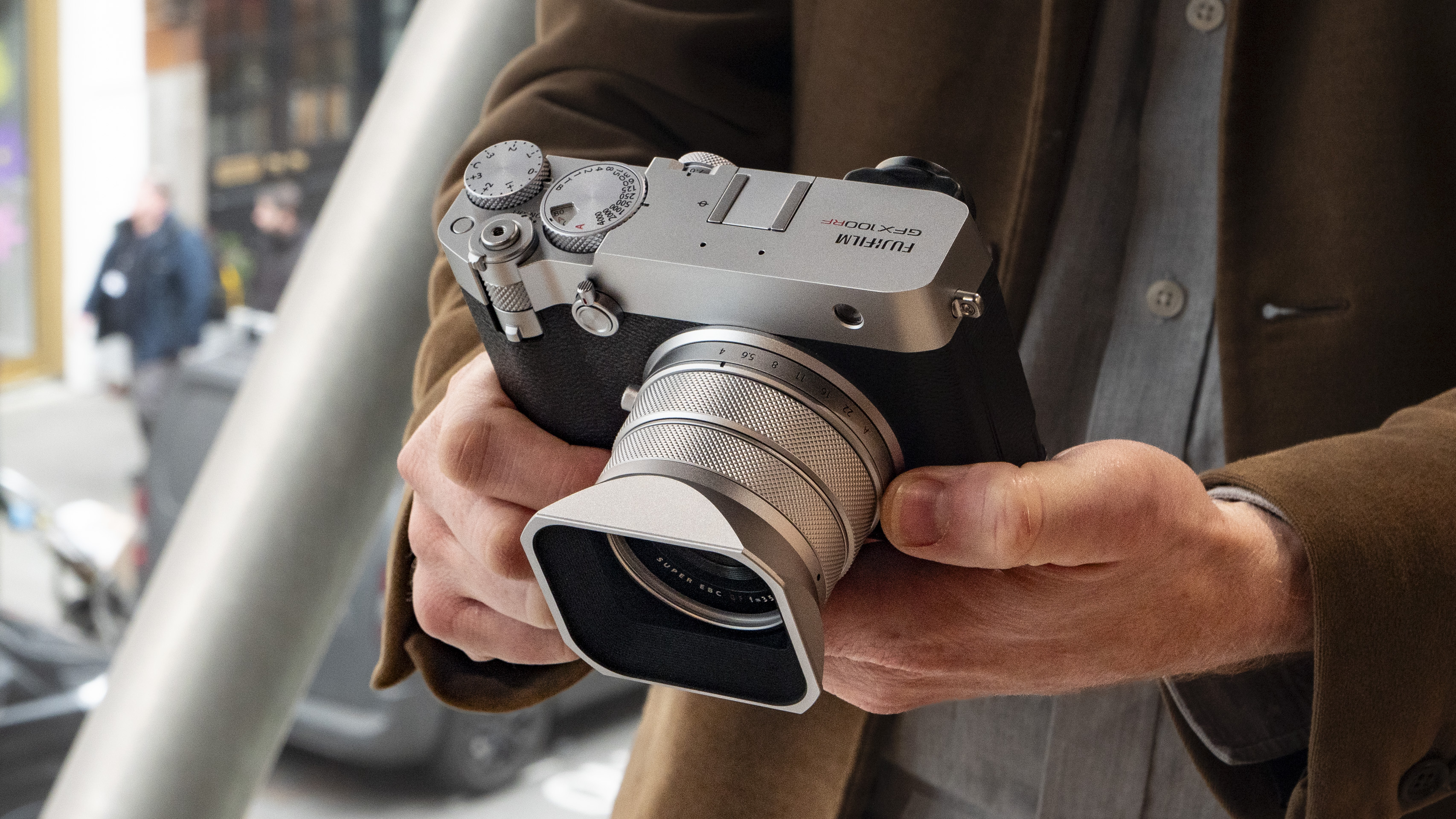Holding the Fujifilm GFX100 RF medium-format compact camera
